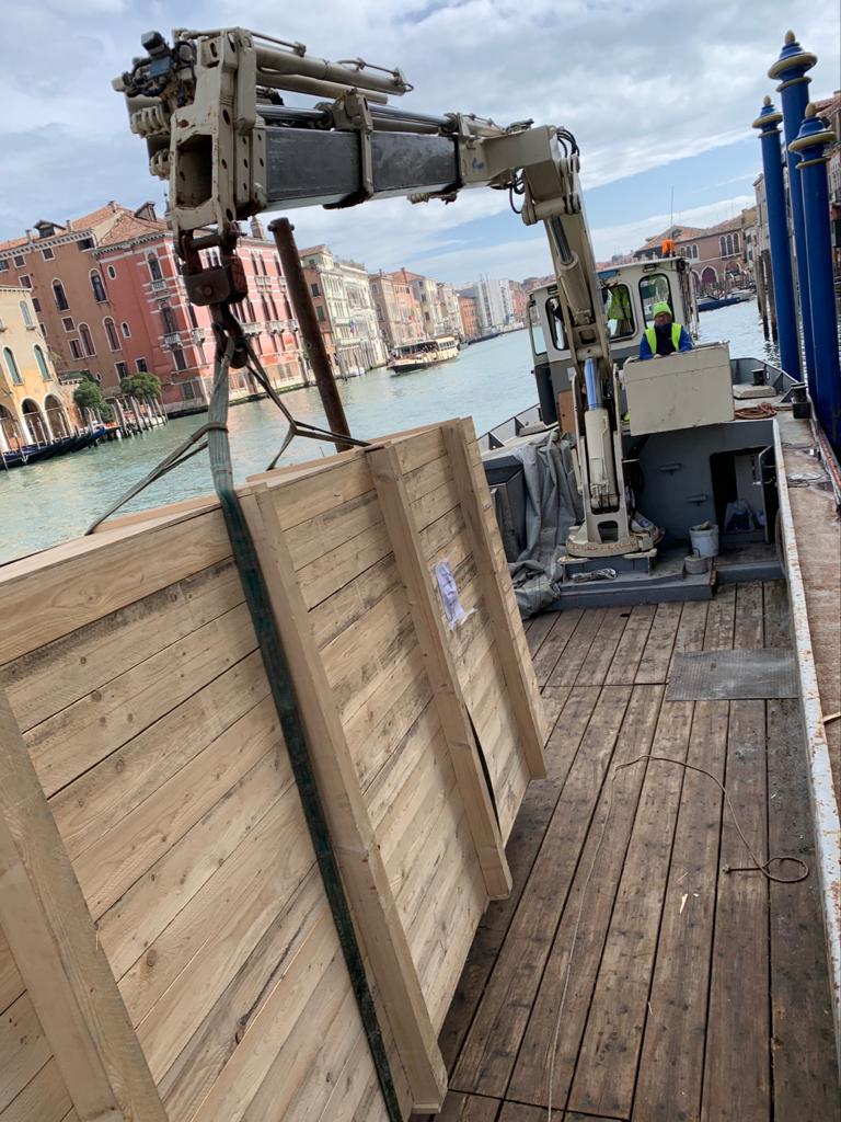 Transporting a work of art by boat along the Grand Canal in Venice.